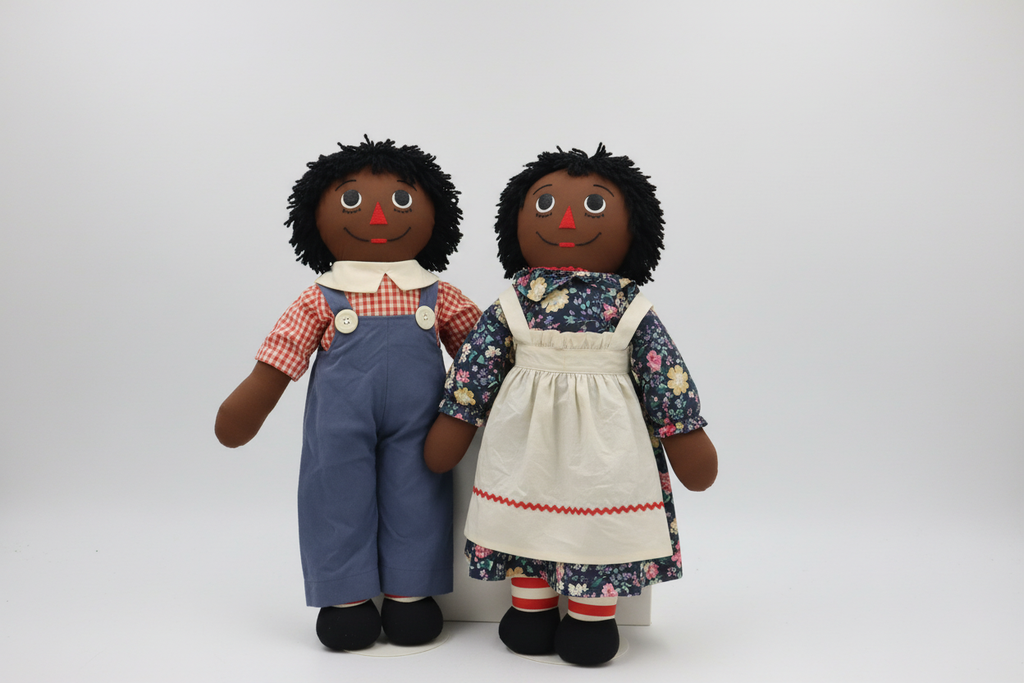 Vintage Black Raggedy Ann and Andy cloth dolls displayed together on neutral background